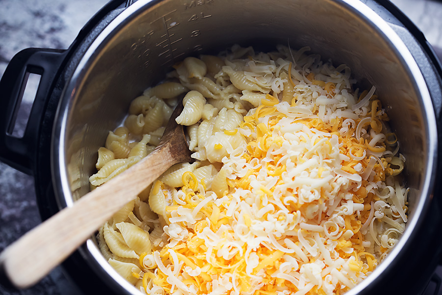 cooked pasta noodles in a instant pot pressure cooker with lots of cheese